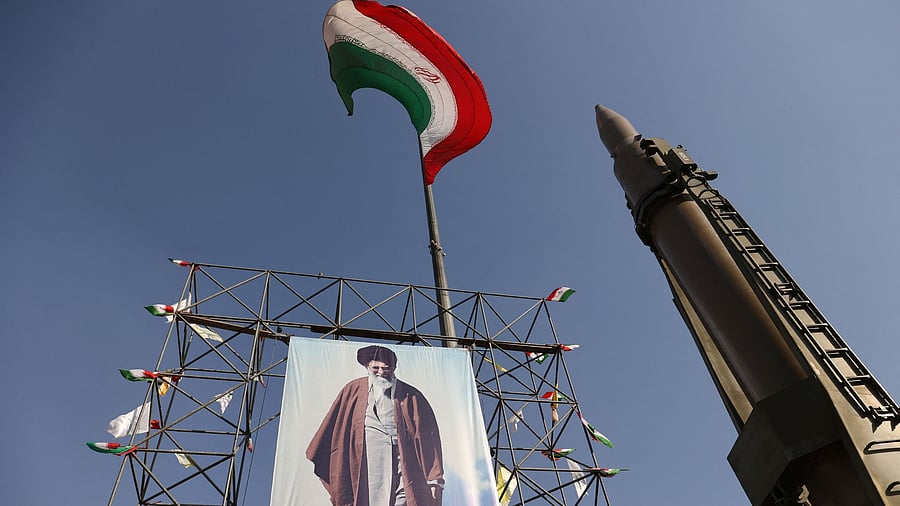 <div class="paragraphs"><p>An Iranian missile system is displayed next to a banner with a picture of Iran's Supreme Leader Ayatollah Ali Khamenei</p></div>