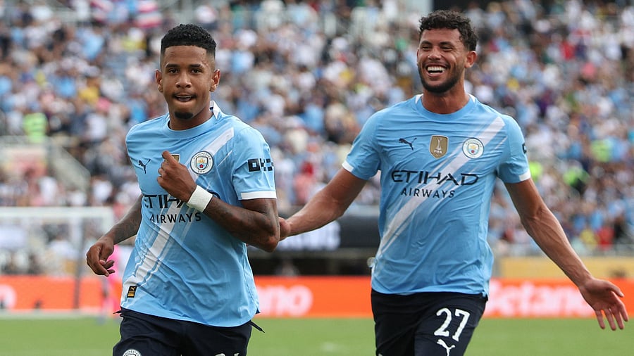 <div class="paragraphs"><p>  Manchester City's Savinho celebrates scoring their fifth goal with Matheus Nunes </p></div>