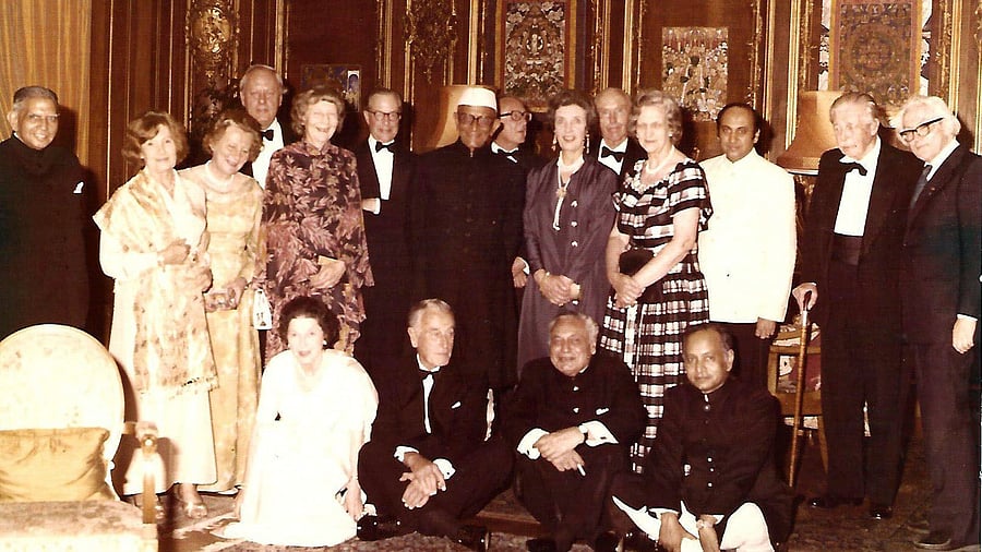 <div class="paragraphs"><p>Taken in June, 1978. Prime Minister Morarji Desai visited London. High Commissioner B K Nehru hosted a banquet in his honour. Former British Prime Ministers, Harold Macmillan, Douglas Hume and Edward Heath, and Lord Mountbatten (cross legged on the floor) attended it. Nazareth is in the second row (standing, third from right).</p></div>