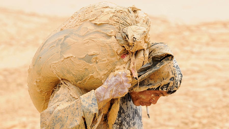 <div class="paragraphs"><p>A man works at the site of a rare earth metals mine at Nancheng county, Jiangxi province, China </p></div>