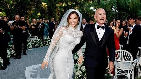 <div class="paragraphs"><p>Amazon Founder Jeff Bezos and Media Personality Lauren Sanchez Bezos react on the day of their wedding in Venice</p></div>