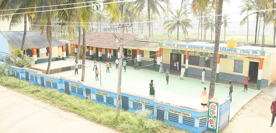 <div class="paragraphs"><p>A tennis court and compound wall constructed at Kallipalya School in Tumakuru's Gubbi taluk. </p></div>