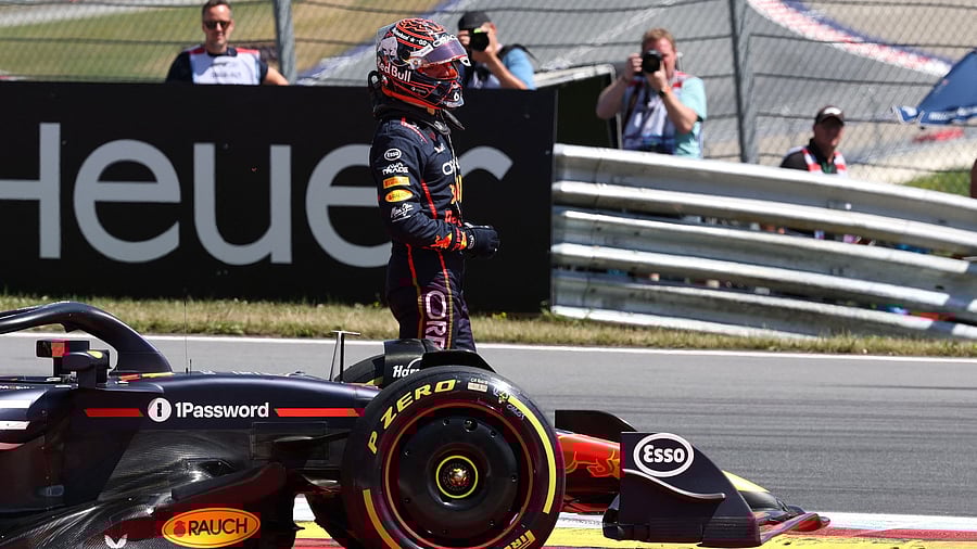 <div class="paragraphs"><p>Red Bull's Max Verstappen looks on before his car is taken off the track after he crashes out.</p></div>