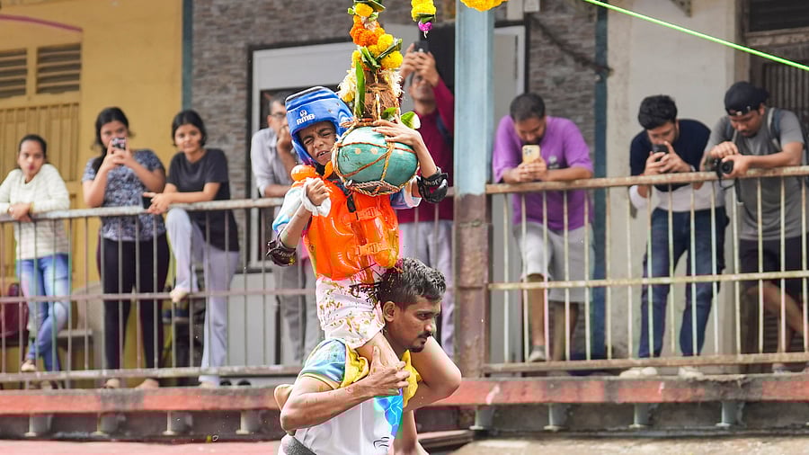 <div class="paragraphs"><p>Mumbai: Govindas form a human pyramid to break an earthen pot (handi) filled with curd and other delicacies during the celebration of Janmashtami festival, in Mumbai.&nbsp;</p></div>
