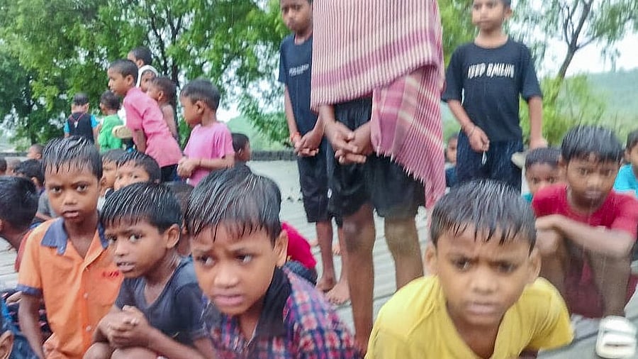 <div class="paragraphs"><p>Students trapped in a residential school after its premises got flooded due to heavy rain, in East Singhbhum district, Jharkhand.</p></div>