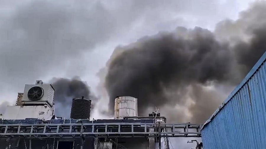 <div class="paragraphs"><p>Sangareddy: Smoke rises after a fire broke out following a reactor explosion at Sigachi Chemical Industry in Pashamailaram, resulting in the death of at least 13 people, in Sangareddy district, Telangana,. </p></div>