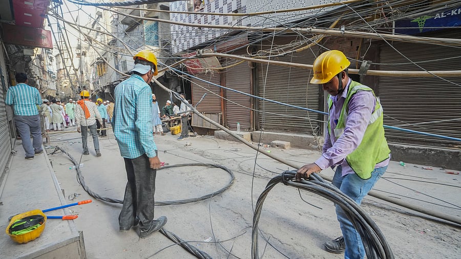 <div class="paragraphs"><p>Workers remove high tension wires near a residential area. (Representative image)</p></div>