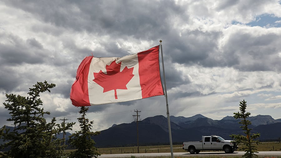 <div class="paragraphs"><p>A Canadian flag flies near the mountains </p></div>