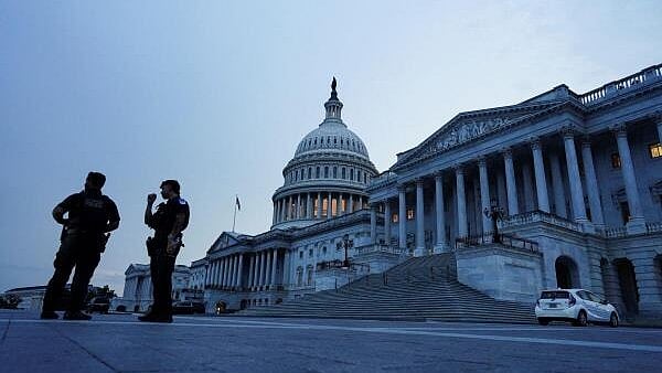 <div class="paragraphs"><p>Police officers stand guard in front of the US Capitol as the US Senate considers U.S. President Donald Trump's sweeping spending and tax bill, on Capitol Hill in Washington</p></div>