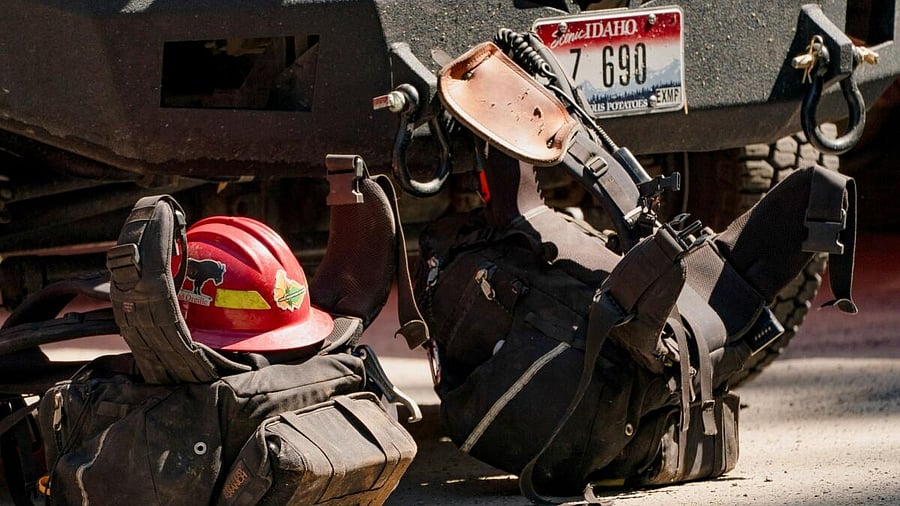 <div class="paragraphs"><p>Firefighting gear sits in a staging area near where two firefighters were shot dead while responding to a fire and the body of a man was later found with a gun nearby in the Canfield Mountain area outside Coeur d’Alene, Idaho, US June 30, 2025.</p></div>