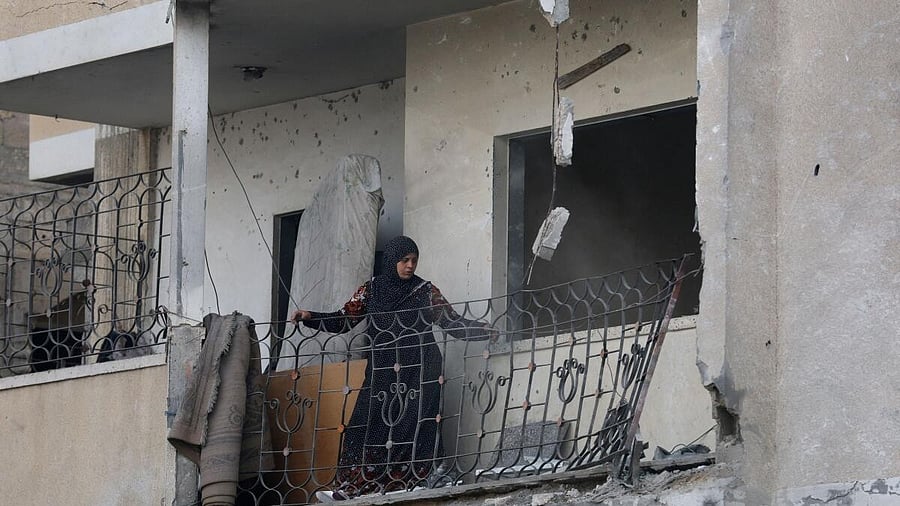 <div class="paragraphs"><p>A Palestinian woman looks at the damage, at the site of an Israeli strike on a house that took place on Monday, in Zawayda in the central Gaza Strip, July 1, 2025.</p></div>