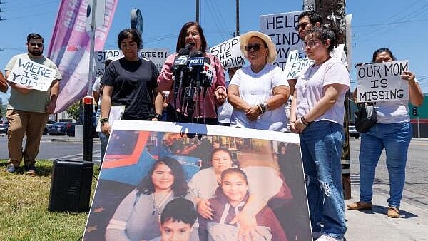 <div class="paragraphs"><p>Family and community members protest in support of a missing migrant mother, in Los Angeles</p></div>