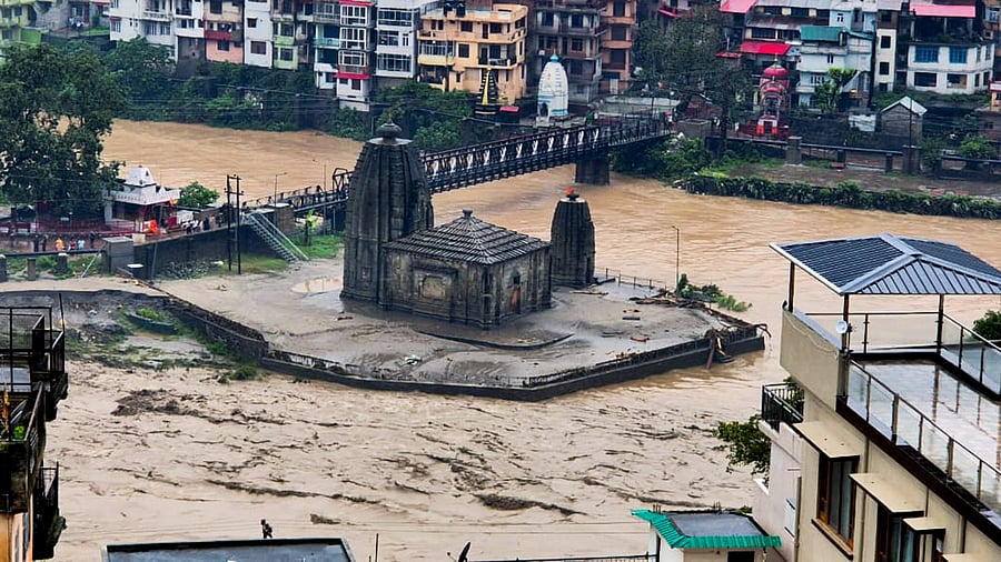 <div class="paragraphs"><p>The Panchvaktra Mahadev Temple at the confluence of the Beas and Suketi rivers flowing in spate after cloudburst, in Mandi district, Tuesday, July 1, 2025. </p></div>