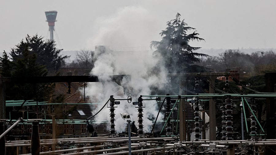 <div class="paragraphs"><p>FILE PHOTO: Smoke rises from the area of an electrical substation, with a control tower from the Heathrow International Airport on the background, after a fire there wiped out the power at the airport, in Hayes, London, Britain.</p></div>