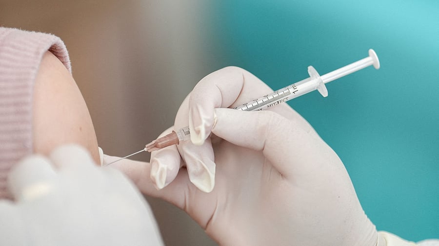 <div class="paragraphs"><p> A woman receives a booster dose of Pfizer-BioNTech vaccine against the coronavirus disease.</p></div>
