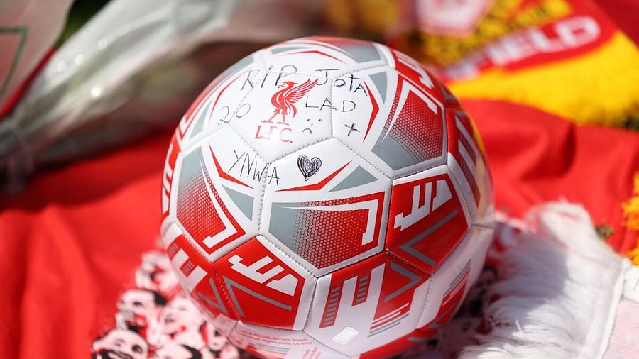 <div class="paragraphs"><p>A soccer ball lies among tributes outside Liverpool's Anfield Stadium after Liverpool's Portuguese soccer player Diogo Jota died in a car crash near Zamora, Spain, in Liverpool, Britain, July 3, 2025.</p></div>