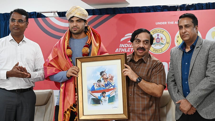 <div class="paragraphs"><p>Olympic medallist Neeraj Chopra (second from left) being felicitated by KOA president K Govindaraj on Thursday. Also present were DYES Sports Commissioner Chethan (left) and Naveen Raj Singh (right), Principal Secretary Sports. </p></div>