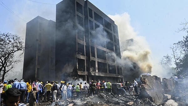 <div class="paragraphs"><p>People at the site after an Air India plane crashed moments after taking off from the airport, in Ahmedabad.</p></div>