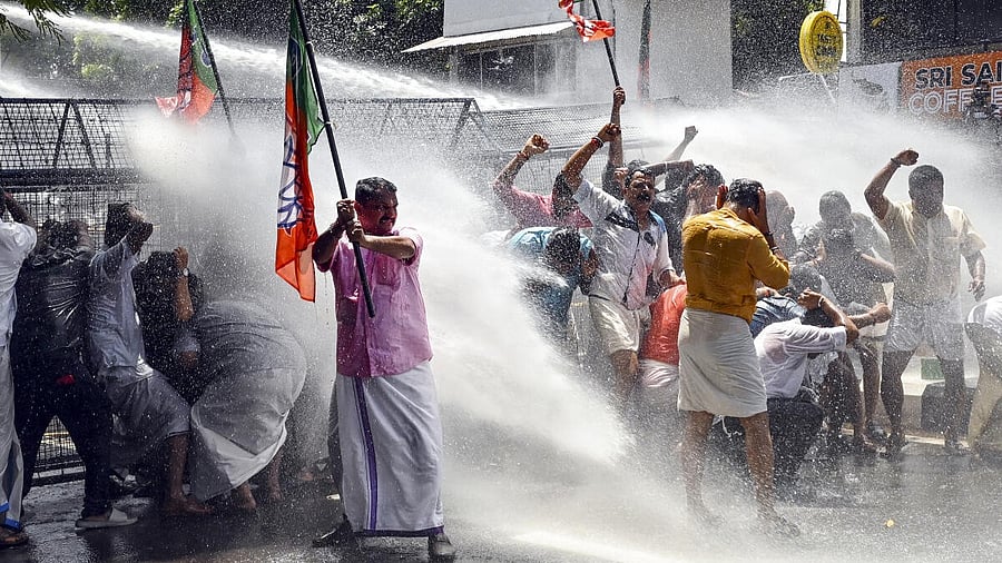 <div class="paragraphs"><p>Police use water cannon to disperse BJP workers during a protest demanding the resignation of Kerala Health Minister Veena George over the death of a woman in a building collapse at Kottayam Medical College, in Thiruvananthapuram, Friday, July 4, 2025.</p></div>