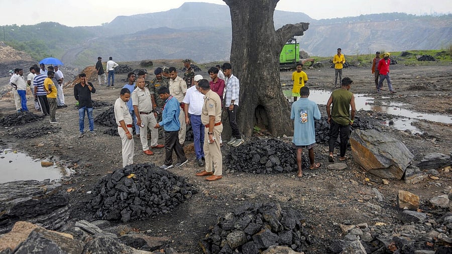 <div class="paragraphs"><p>Police personnel and others inspects the site at Karma area, where 4 persons was killed and some others were feared trapped after a portion of a coal mine collapsed.</p></div>