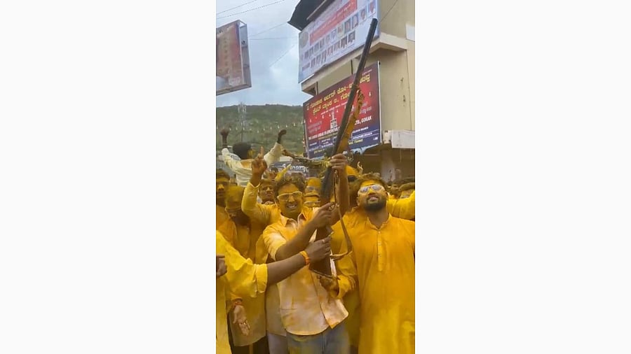 <div class="paragraphs"><p>Gokak MLA Ramesh Jarkiholi's son Santosh firing in the air during the car festival of goddess Sri Mahalaxmi fair at Gokak town in Belagavi district.</p></div>