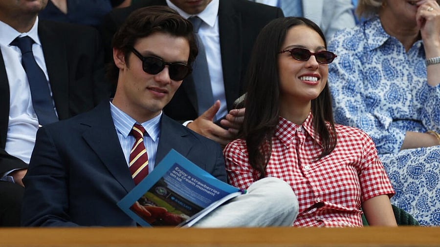 <div class="paragraphs"><p>Singer Olivia Rodrigo (left) with her partner and actor Louis Partridge (right) in the Royal Box on Centre Court during the second round match between Spain's Carlos Alcaraz and Britain's Oliver Tarvet.</p></div>