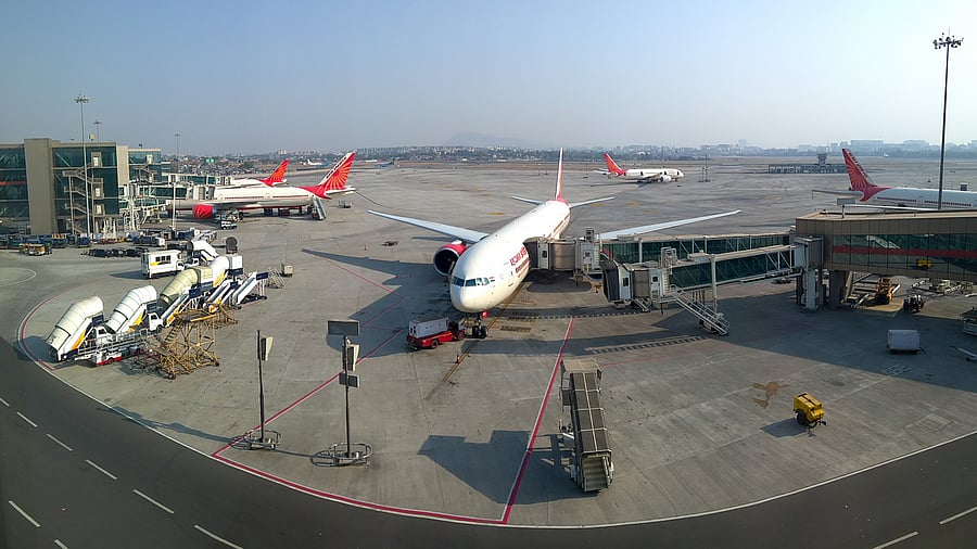 <div class="paragraphs"><p>Air India airplanes sitting on the tarmac at the Mumbai International airport in India.</p></div>
