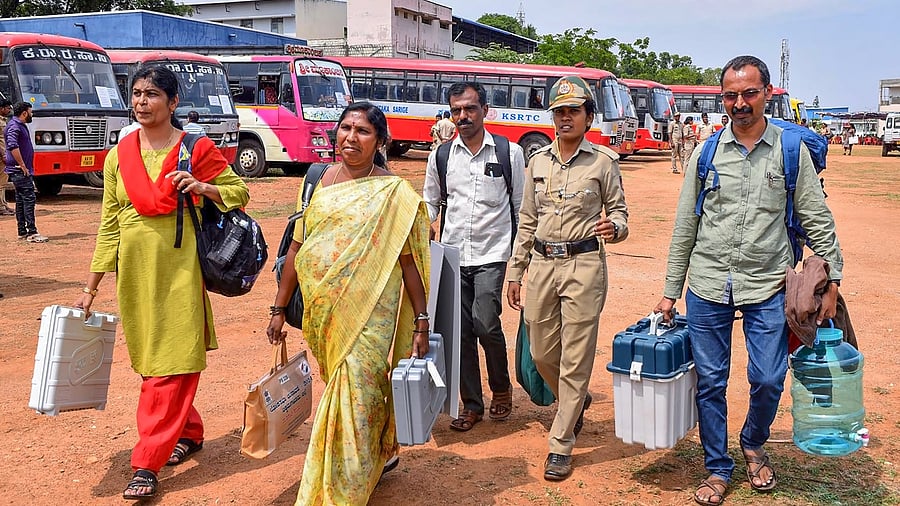 <div class="paragraphs"><p>Polling officials.</p></div>