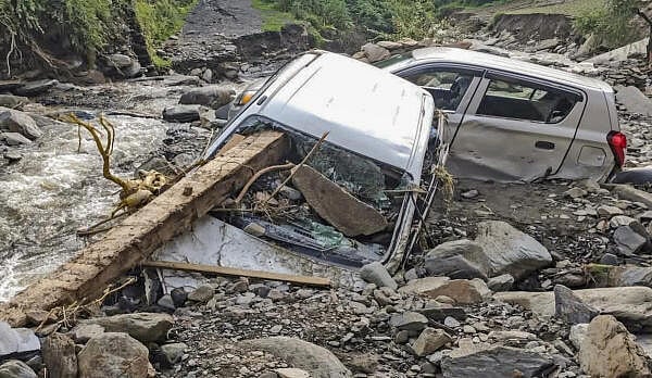 <div class="paragraphs"><p>Vehicles stuck in debris at an area affected by the recent cloudburst and flash floods, in Mandi district.</p></div>