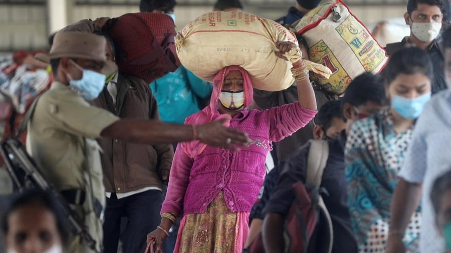 <div class="paragraphs"><p>A policeman directs crowd at a railway station amidst the spread of the coronavirus disease (Covid-19) in Mumbai, India, December 4, 2020. </p></div>