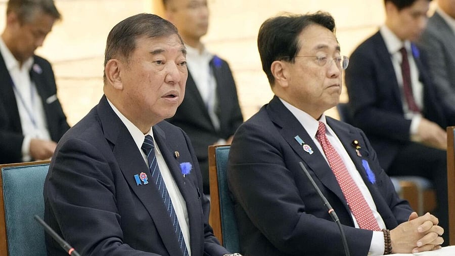 <div class="paragraphs"><p>Japan's Prime Minister Shigeru Ishiba speaks next to Economic Revitalization Minister Ryosei Akazawa during a meeting with cabinet ministers to discuss Japan's strategy in dealing with U.S. tariffs, at Ishiba's official residence in Tokyo, Japan July 8, 2025, in this photo taken by Kyodo.</p></div>