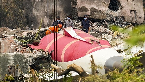 <div class="paragraphs"><p>Wreckage of the crashed Air India plane being lifted through a crane, in Ahmedabad, Gujarat.</p></div>