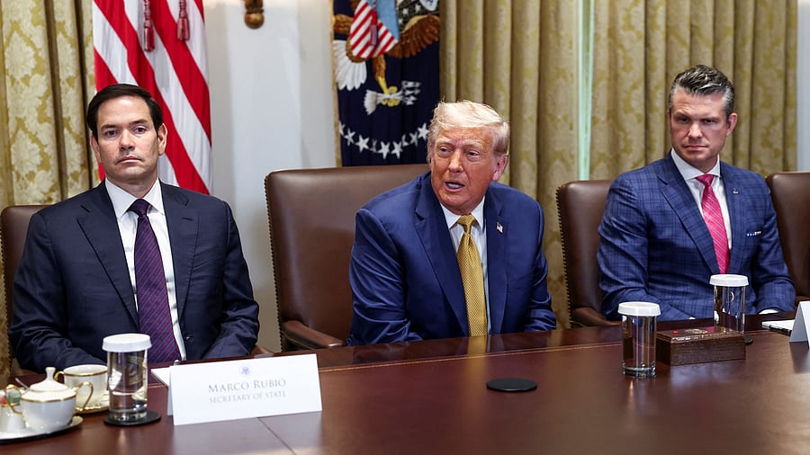 <div class="paragraphs"><p>US Secretary of State Marco Rubio (L) and US President Donald Trump (centre).</p></div>