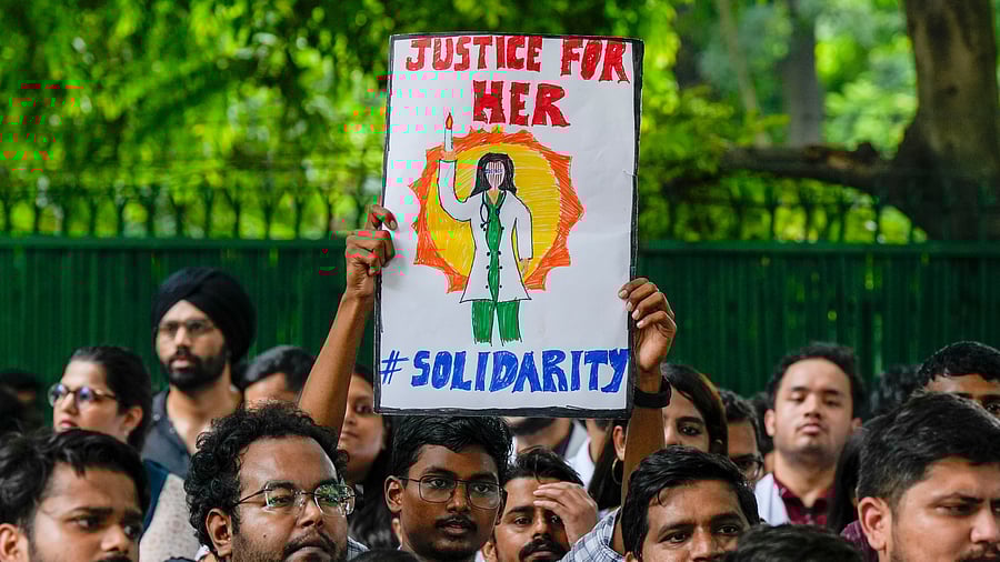 <div class="paragraphs"><p>Doctors protest against the alleged rape and murder of a trainee doctor at Kolkata's RG Kar Medical College and Hospital.</p></div>
