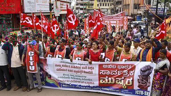 <div class="paragraphs"><p>Members of various trade unions take out a protest rally during a 24-hour nationwide general strike called by trade unions against the central government's alleged anti-labour policies, in Hubballi, Karnataka.</p></div>