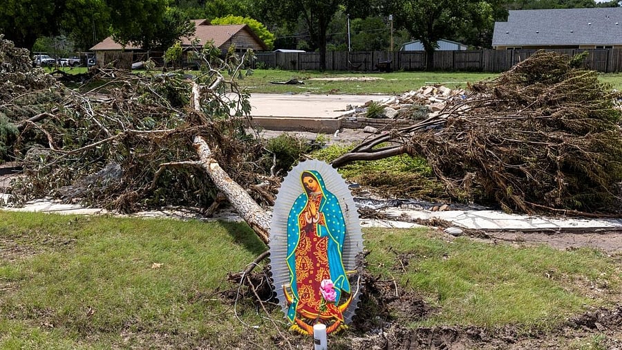 <div class="paragraphs"><p>An image of the Virgin Mary sits next to fallen trees near the Guadalupe River, in Hunt, Texas, U.S. July 9, 2025.</p></div>