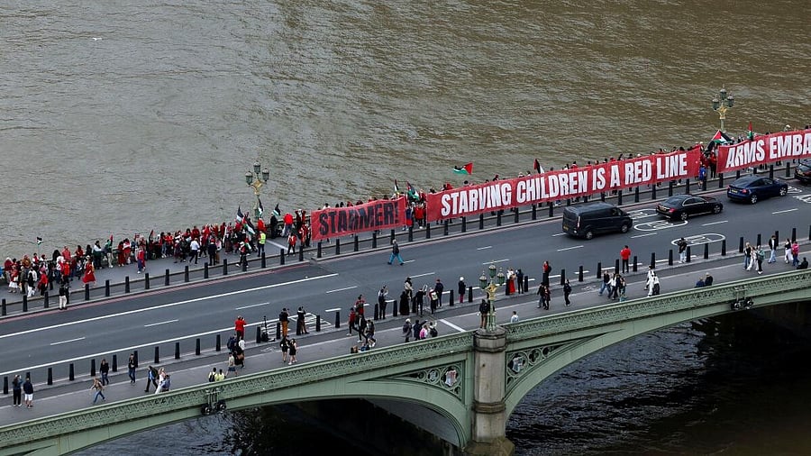 <div class="paragraphs"><p>Pro-Palestinian demonstrators hold a banner outside the UK Parliament during a demonstration organised by campaign groups including Palestine Solidarity Campaign, Avaaz and Parents for Palestine, calling for sanctions on Israel over ongoing hunger among Gaza's war-struck population, in London, Britain.</p></div>