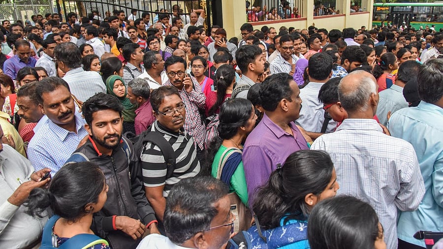 <div class="paragraphs"><p>Anxious students and parents outside the KEA office.</p></div>