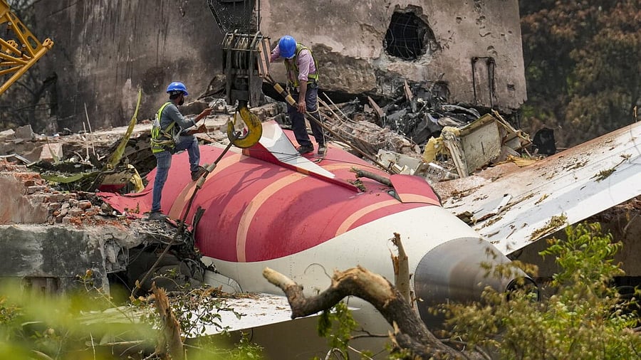 <div class="paragraphs"><p>In this Saturday, June 14, 2025 file photo, wreckage of the crashed Air India plane, which crashed into a medical hostel and its canteen complex moments after taking off from the Sardar Vallabhbhai Patel International Airport, being lifted through a crane, in Ahmedabad, Gujarat.</p></div>