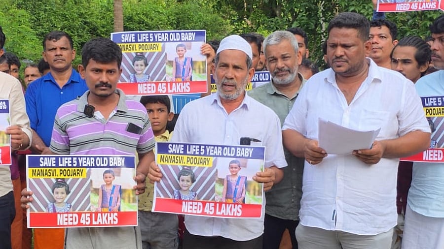 <div class="paragraphs"><p>Cutting across religions, villagers led by Fayaz Madoor (from right) raised money to save the life of Hiranyaksha's five year-old cancer-afflicted daughter from Karpe village in Bantwal taluk. </p></div>