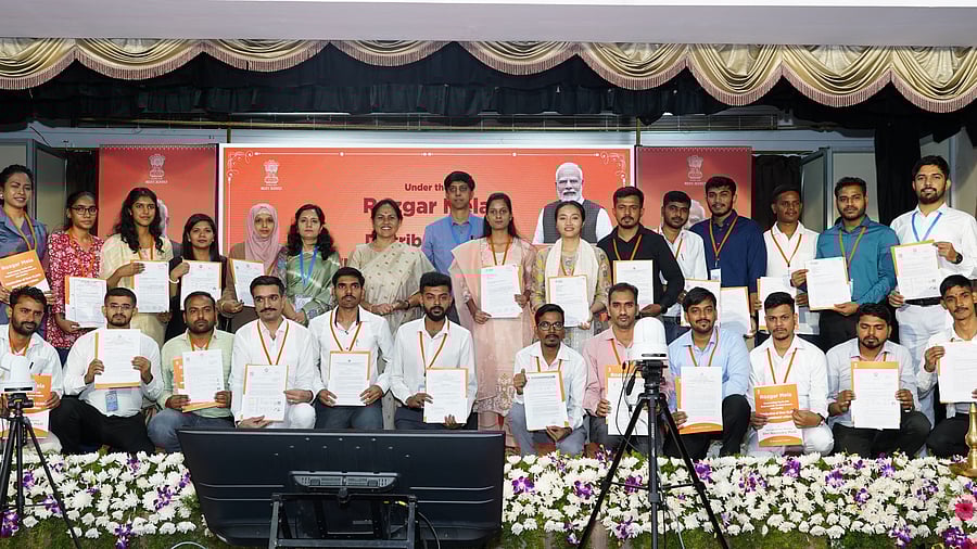 <div class="paragraphs"><p>Union Minister Shobha Karandlaje with the new recruits at the Rozgar Mela on Saturday. </p></div>
