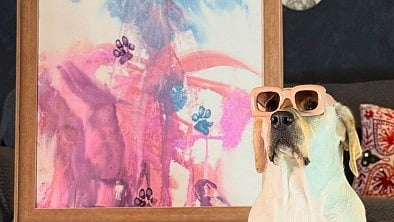 <div class="paragraphs"><p>Dali with her painting. </p></div>