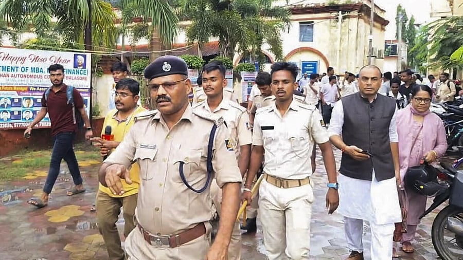 <div class="paragraphs"><p>Police personnel investigate after a female student allegedly set herself on fire over sexual harassment at Fakir Mohan (Autonomous) College, in Balasore district.</p></div>