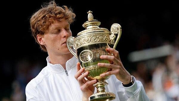 <div class="paragraphs"><p>Italy's Jannik Sinner celebrates with the trophy after winning the men's final against Spain's Carlos Alcaraz.</p></div>