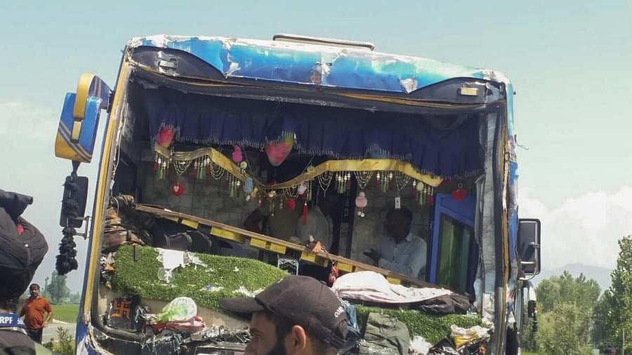 <div class="paragraphs"><p>Security personnel stand near a damaged bus after a multi-vehicle collision at Khudwani, in Kulgam district</p></div>