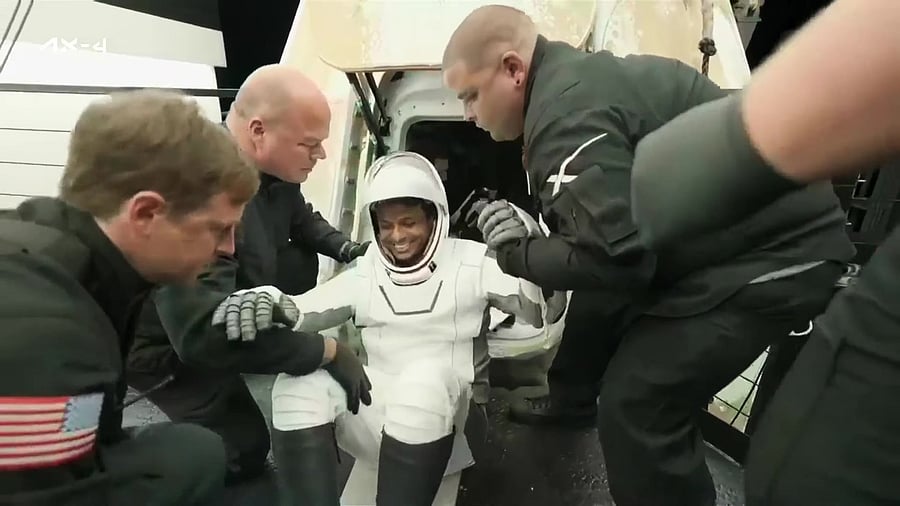 <div class="paragraphs"><p>Shubhanshu Shukla and Axiom-4 crew being assisted out of the Dragon Spacecraft onto the recovery vehicle after their return to earth.&nbsp;</p></div>