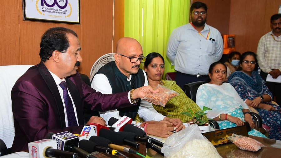 <div class="paragraphs"><p>Karnataka State Food Commission Chairperson Dr H Krishna displays food products found at Nutritional Rehabilitation Centre (NRC) of Chaluvamba Hospital during a press meet after inspection of hospitals of MMC and RI in Mysuru on Wednesday. </p></div>