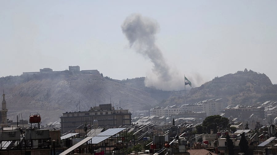 <div class="paragraphs"><p>Smoke rises following Israeli airstrike next to the presidential palace in Syria's capital Damascus, July 16, 2025. </p></div>