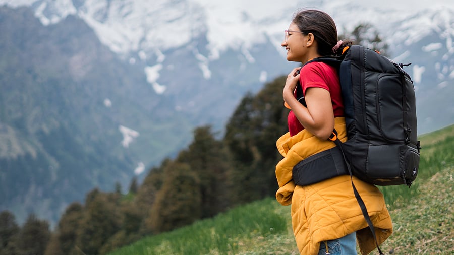 <div class="paragraphs"><p>A woman at a hillside travel destination. </p></div>