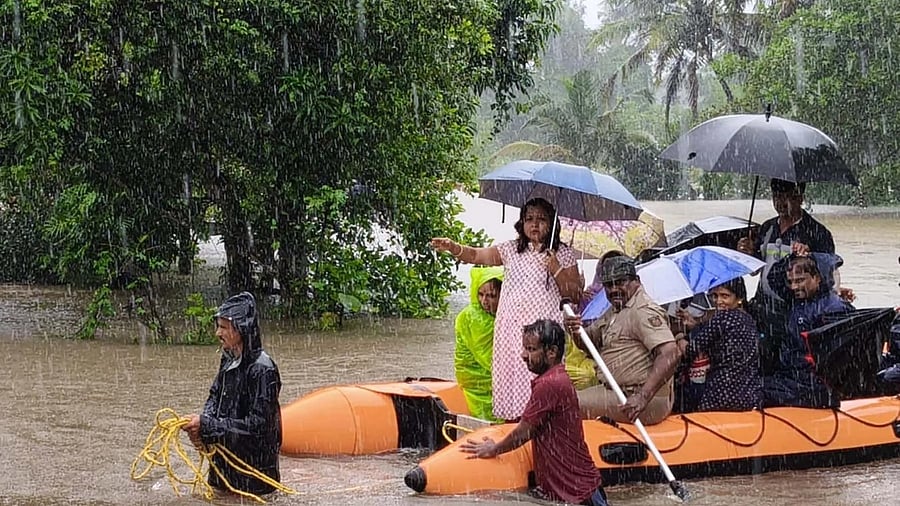 <div class="paragraphs"><p>People are ferried to safer places on a a boat in Kapu taluk of Udupi district following heavy showers on Thursday. </p></div>